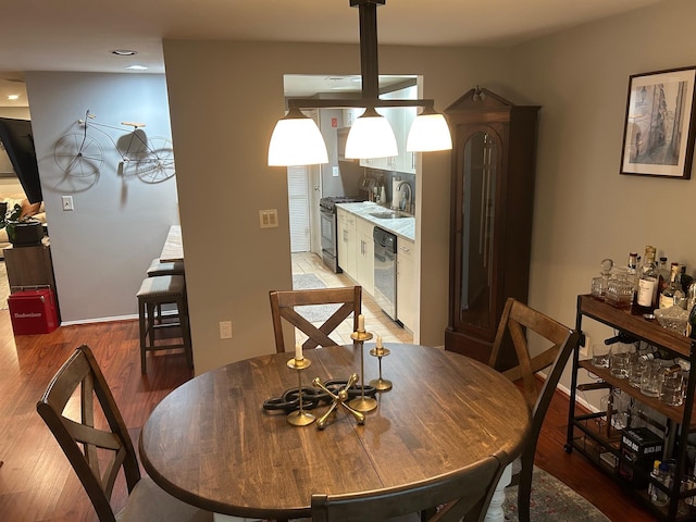 118 Skyline Dr, Coram, NY 11727 - dining room with light wood finished floors and recessed lighting