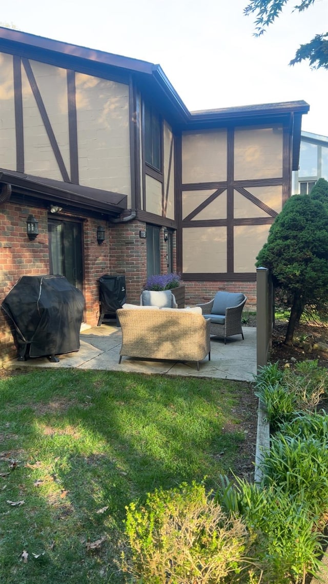 118 Skyline Dr, Coram, NY 11727 - back of house featuring brick siding, a patio, and a lawn