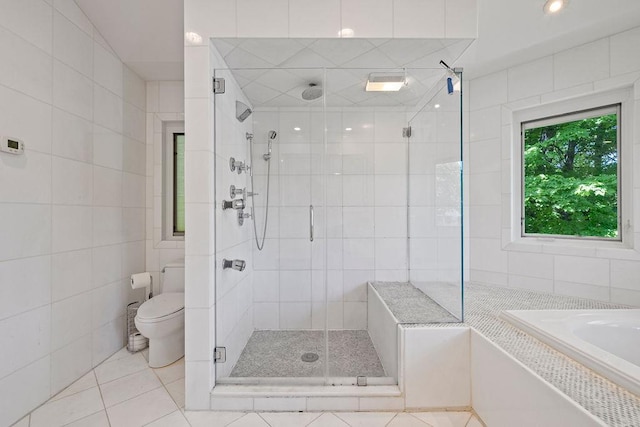 8 Beaumont Dr, New City, NY 10956 - bathroom featuring tile walls, a shower stall, toilet, tile patterned flooring, and a garden tub