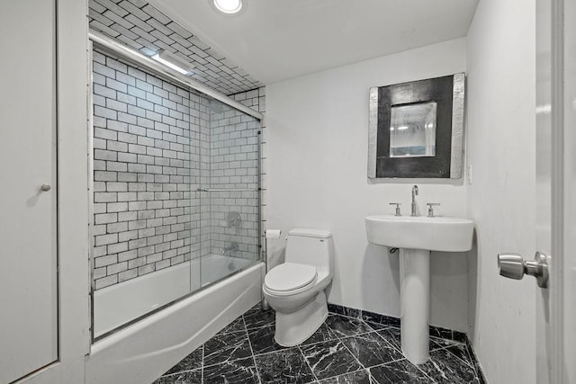 8 Beaumont Dr, New City, NY 10956 - bathroom with marble look tiles, toilet, baseboards, bath / shower combo with glass door, and recessed lighting