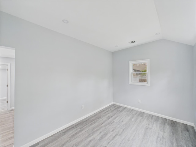 495 Easton St, Ronkonkoma, NY 11779 - spare room featuring light wood-type flooring, baseboards, and lofted ceiling