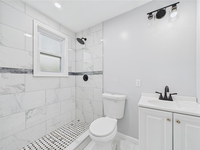 495 Easton St, Ronkonkoma, NY 11779 - full bathroom with a tile shower, toilet, vanity, and baseboards