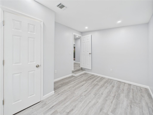 495 Easton St, Ronkonkoma, NY 11779 - unfurnished bedroom with wood finished floors, baseboards, and recessed lighting