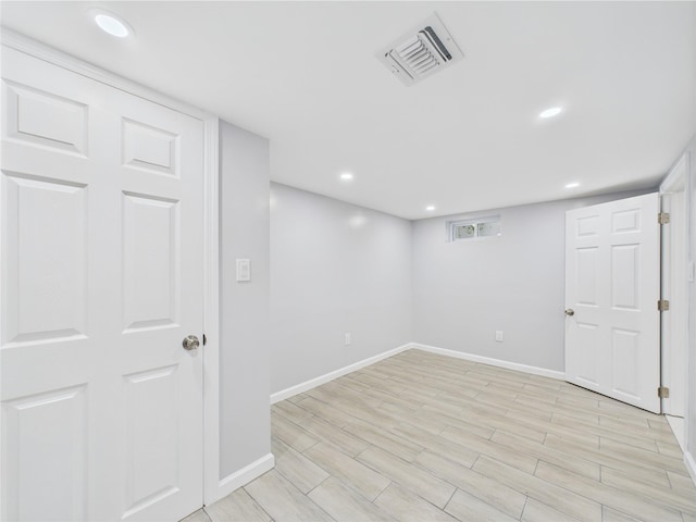 495 Easton St, Ronkonkoma, NY 11779 - finished below grade area with baseboards, light wood-style floors, and recessed lighting