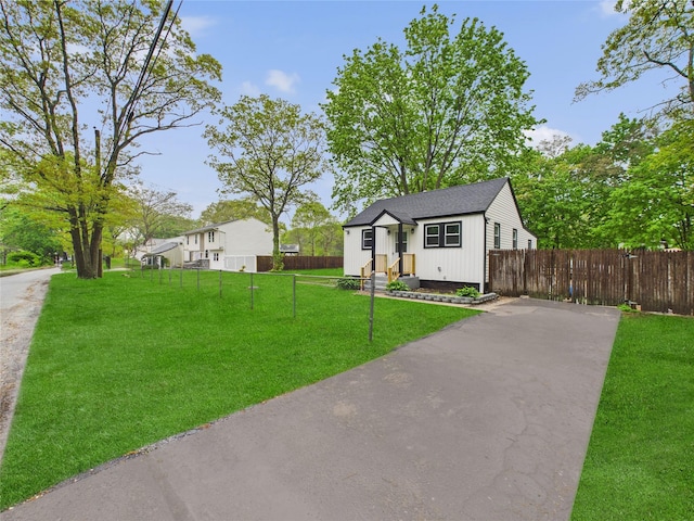 495 Easton St, Ronkonkoma, NY 11779 - bungalow featuring driveway and roof with shingles