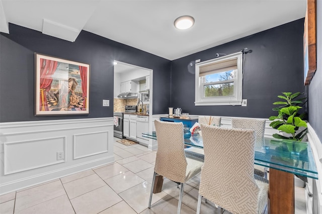 dining area with wainscoting