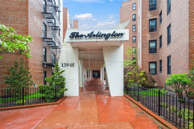 139-15 83rd Ave Unit 409, Briarwood, NY 11435 - view of building exterior with fence