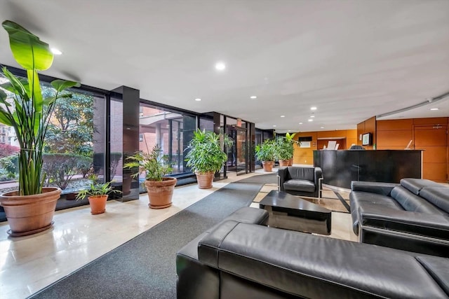139-15 83rd Ave Unit 409, Briarwood, NY 11435 - community lobby with a wall of windows and recessed lighting