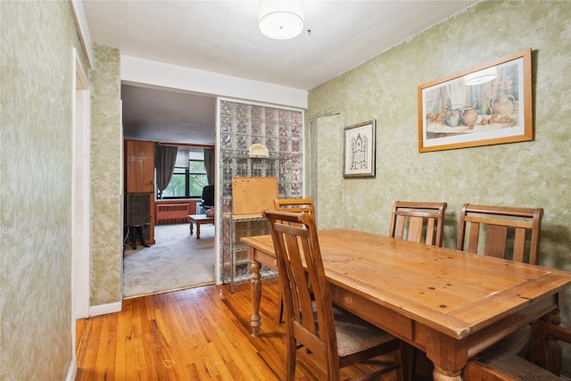139-15 83rd Ave Unit 409, Briarwood, NY 11435 - dining room with hardwood / wood-style flooring and radiator heating unit