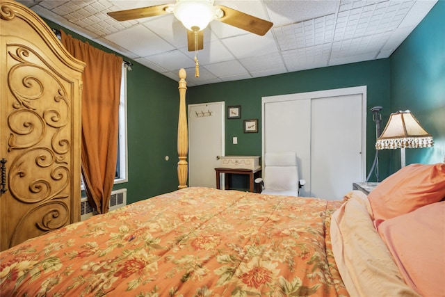 139-15 83rd Ave Unit 409, Briarwood, NY 11435 - bedroom with a drop ceiling, a closet, and a ceiling fan