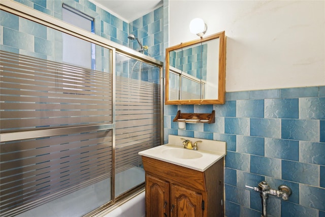 139-15 83rd Ave Unit 409, Briarwood, NY 11435 - bathroom with bath / shower combo with glass door, tile walls, and vanity