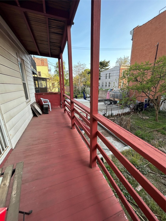 wooden terrace featuring a porch