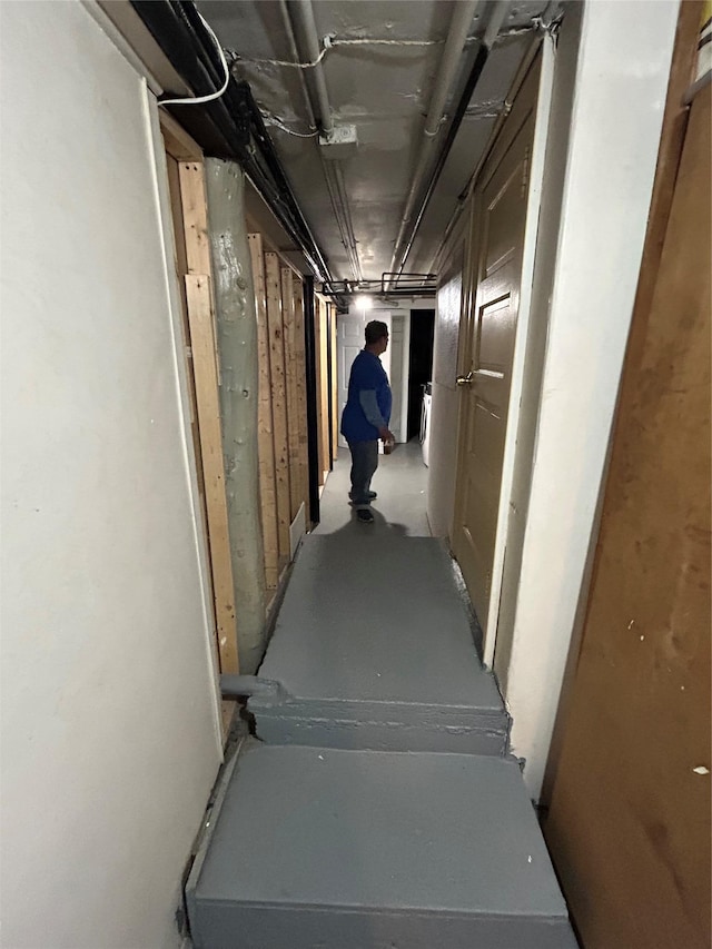 hall featuring concrete floors