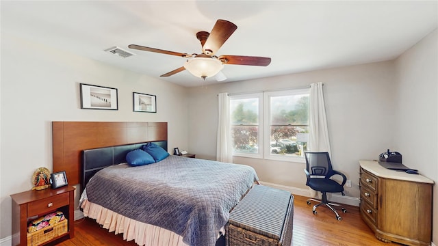 1079 Candlewood Rd, Brentwood, NY 11717 - bedroom featuring light wood-style flooring, baseboards, and a ceiling fan