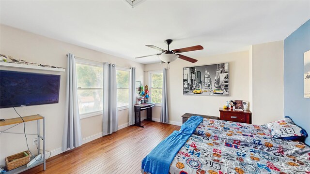 1079 Candlewood Rd, Brentwood, NY 11717 - bedroom with wood finished floors, baseboards, and ceiling fan