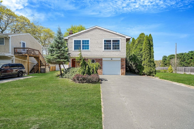view of front of property with brick siding, stairway, asphalt driveway, an attached garage, and a chimney