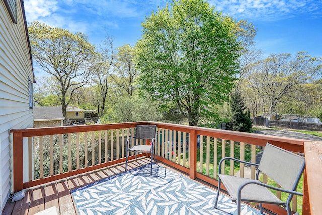 deck with a storage shed and an outdoor structure