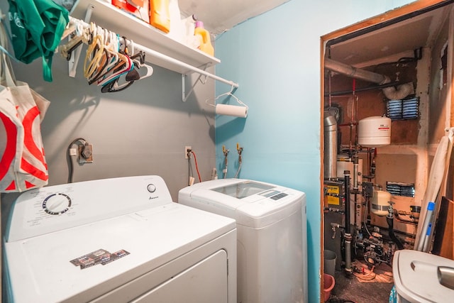 clothes washing area with washing machine and clothes dryer