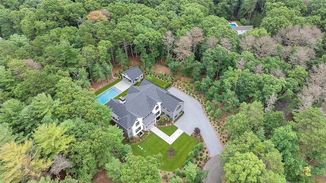 view from above of property featuring a forest