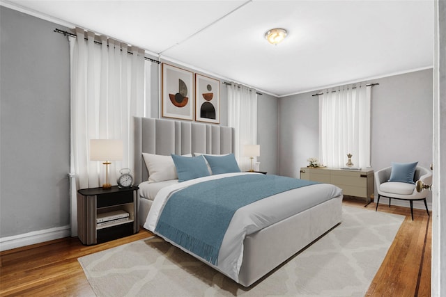 43-08 41st St Unit 5D, Sunnyside, NY 11357 - bedroom featuring wood finished floors, baseboards, and crown molding