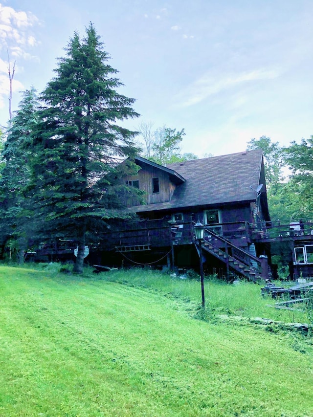 back of house featuring stairway