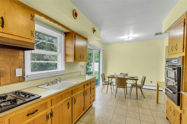 12 Harvard Dr, Hampton Bays, NY 11946 - kitchen featuring oven, a warming drawer, a sink, gas stovetop, and light countertops