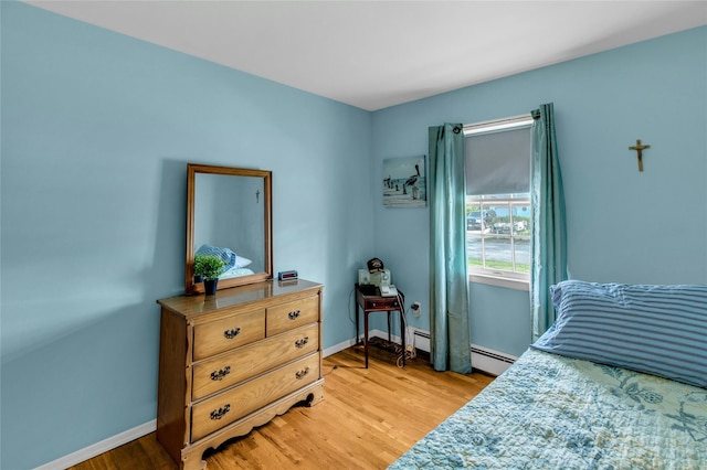 12 Harvard Dr, Hampton Bays, NY 11946 - bedroom with light wood-type flooring and baseboards