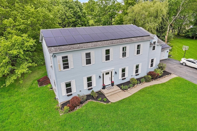 8 Red Oak Ct, Middletown, NY 10941 - view of front facade featuring a shingled roof, roof mounted solar panels, a front lawn, and a garage