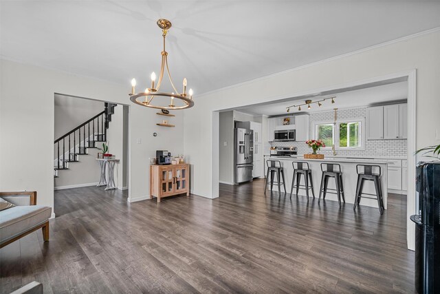 8 Red Oak Ct, Middletown, NY 10941 - living room with a chandelier, dark wood-style flooring, stairway, crown molding, and baseboards