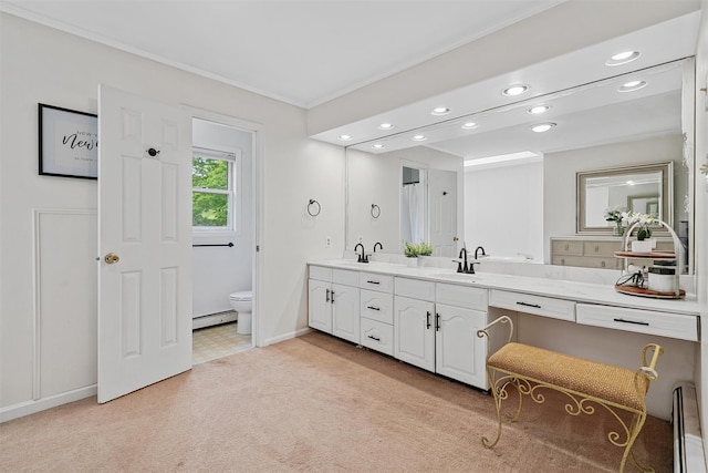 8 Red Oak Ct, Middletown, NY 10941 - full bath with a baseboard heating unit, recessed lighting, toilet, double vanity, and ornamental molding