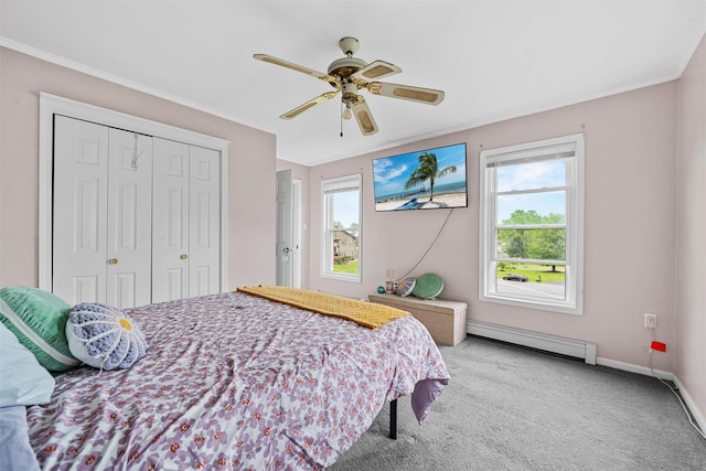 8 Red Oak Ct, Middletown, NY 10941 - carpeted bedroom with baseboard heating, a closet, baseboards, ceiling fan, and crown molding
