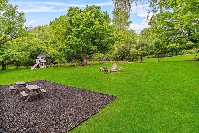 8 Red Oak Ct, Middletown, NY 10941 - view of grassy yard with a playground and a fire pit