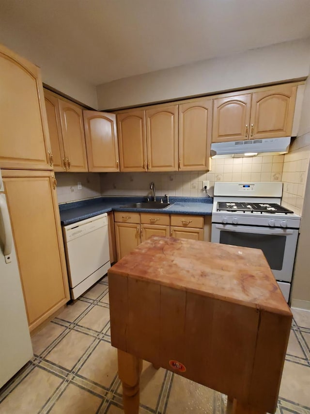 kitchen with white appliances, under cabinet range hood, light brown cabinetry, butcher block countertops, and tasteful backsplash