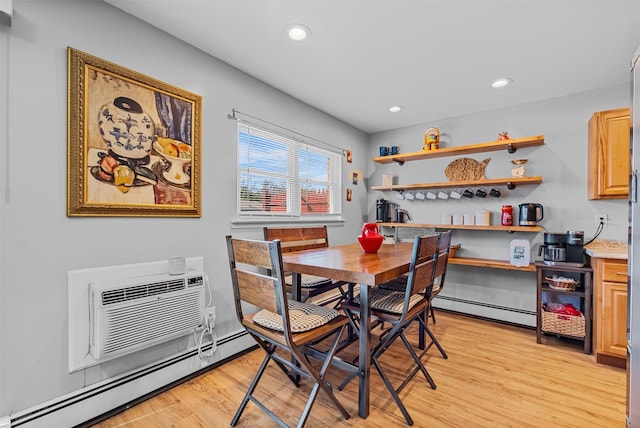 dining room featuring a baseboard radiator, light wood-style floors, recessed lighting, and an AC wall unit
