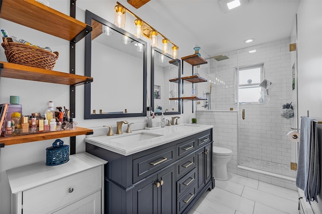 bathroom featuring marble finish flooring, a shower stall, double vanity, toilet, and recessed lighting