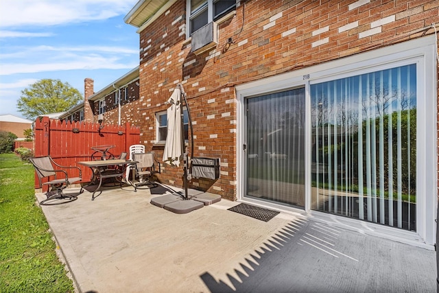 view of patio / terrace featuring fence