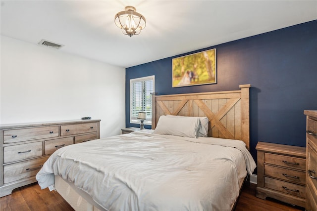 bedroom featuring dark wood-style flooring