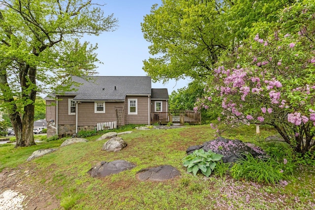 803 Oakwood Dr, Peekskill, NY 10566 - back of property featuring a wooden deck, roof with shingles, and a lawn