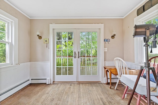 803 Oakwood Dr, Peekskill, NY 10566 - entryway featuring plenty of natural light, crown molding, light wood-style floors, french doors, and baseboard heating