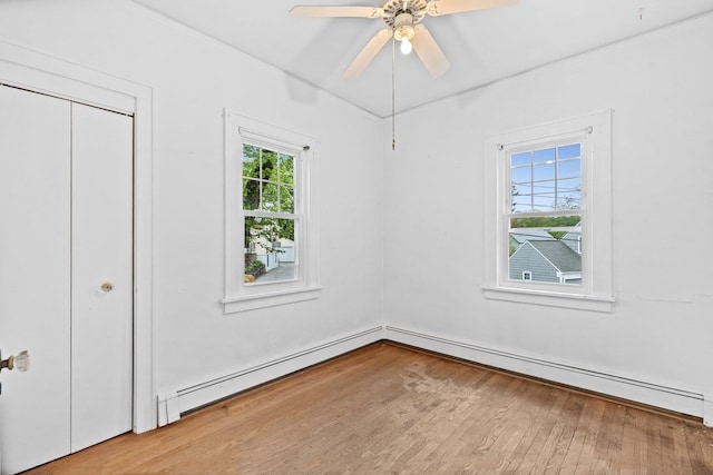 803 Oakwood Dr, Peekskill, NY 10566 - unfurnished bedroom with wood finished floors, ornamental molding, a baseboard radiator, and ceiling fan