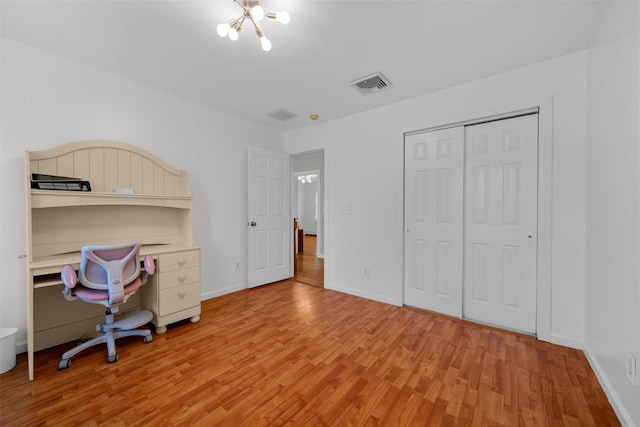 9 Hill Rd, Washingtonville, NY 10992 - unfurnished bedroom featuring light wood-type flooring, baseboards, a closet, and a chandelier