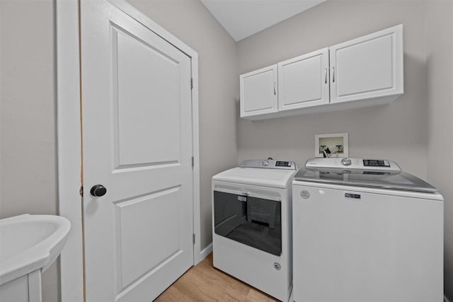 9 Hill Rd, Washingtonville, NY 10992 - laundry area with washer and clothes dryer, cabinet space, and light wood-type flooring