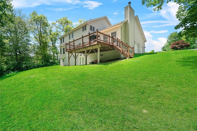 9 Hill Rd, Washingtonville, NY 10992 - rear view of property with a wooden deck, a lawn, and a chimney