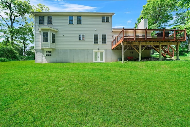 9 Hill Rd, Washingtonville, NY 10992 - rear view of house featuring french doors, a lawn, a wooden deck, and stairway