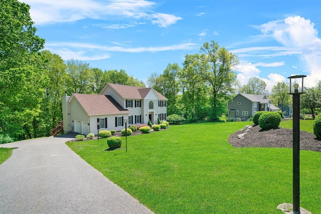 9 Hill Rd, Washingtonville, NY 10992 - colonial inspired home with a front lawn and asphalt driveway