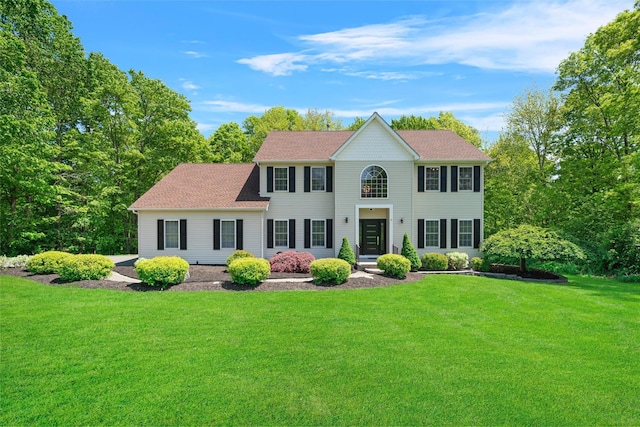 9 Hill Rd, Washingtonville, NY 10992 - colonial home with a front yard and a shingled roof