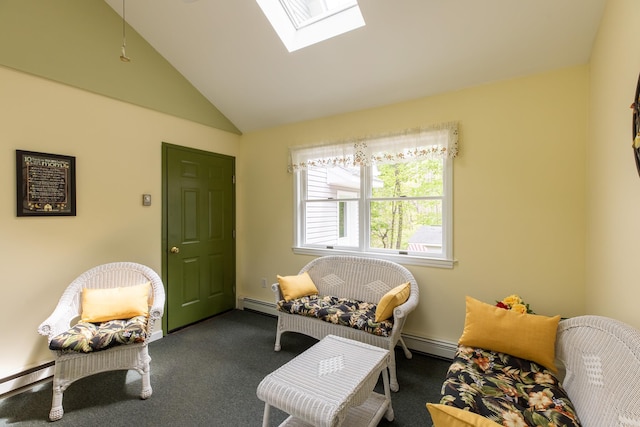 sitting room with a baseboard heating unit, a skylight, vaulted ceiling, carpet flooring, and baseboard heating