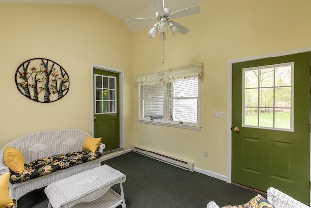 entryway featuring baseboard heating, lofted ceiling, dark carpet, a ceiling fan, and baseboards