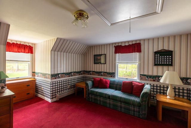 sitting room featuring wallpapered walls, a baseboard heating unit, attic access, and carpet