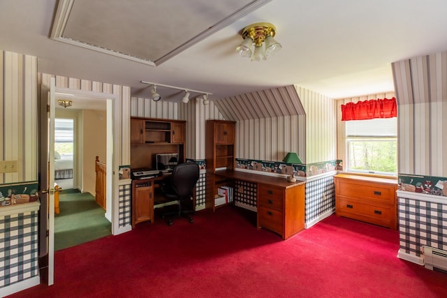 office space with wallpapered walls, dark colored carpet, a baseboard heating unit, and attic access